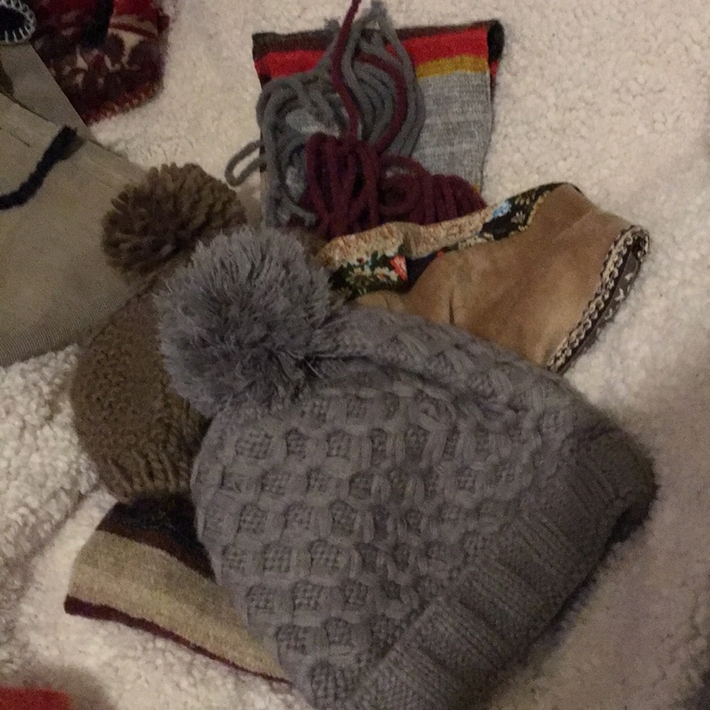 3 hats and a multi colored scarf for winter